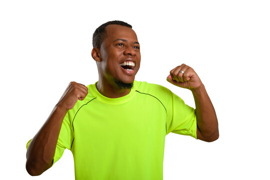 Fan cheering while wearing a neon green shirt.