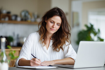Young woman engaged in creative work at a cozy home office