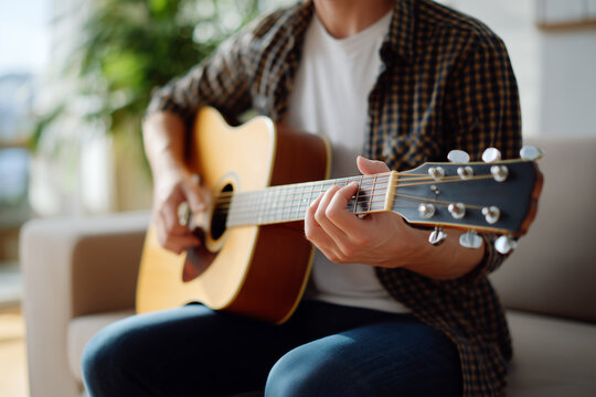 Strumming chords in a cozy living room on a sunny afternoon