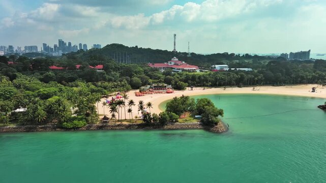 Sentosa Island, Singapore: Aerial view of Tanjong Beach on famous island resort, tropical white sand, lush greenery - landscape panorama of Southeast Asia from above
