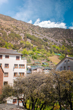 Residential buildings and Pyrenees mountains in Andorra la Vella Old town on a sunny day