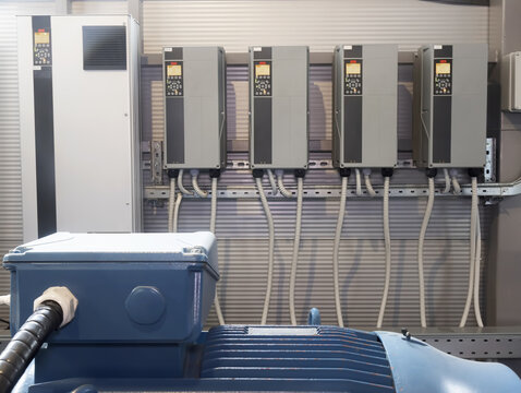 Industrial electric motor control system with frequency converters