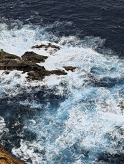 Steep cliffs and coastal landscape with waves on Madeira in autumn
