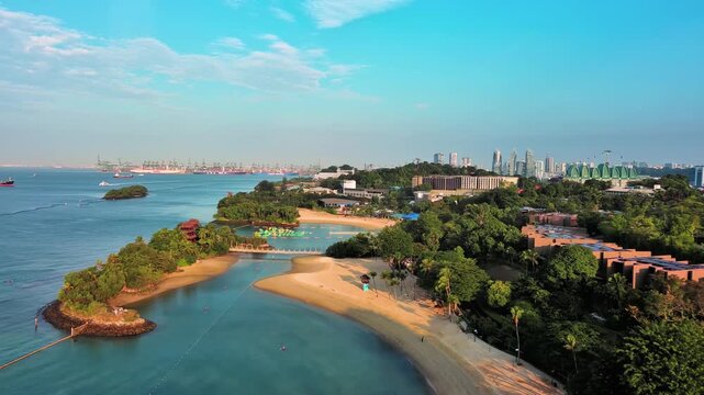 Sentosa Island, Singapore: Aerial view of Palawan Beach on famous island resort, tropical white sand, lush greenery - landscape panorama of Southeast Asia from above
