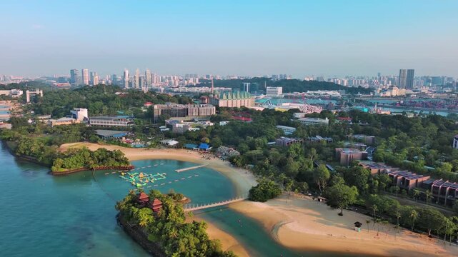 Sentosa Island, Singapore: Aerial view of Palawan Beach on famous island resort, tropical white sand, lush greenery - landscape panorama of Southeast Asia from above
