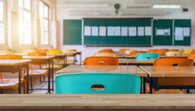 Empty classroom with colorful chairs and wooden desks in the morning light