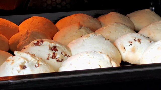 Homemade buns are baked in the oven close-up. Homemade pastries, dough preparations