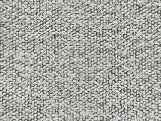 Fototapeta premium Close up texture of black and white boucle fabric. Curled and nubby knitted tufted texture. Suitable for sofa, upholstery, curtain, and drapery. Seamless background fabric texture.