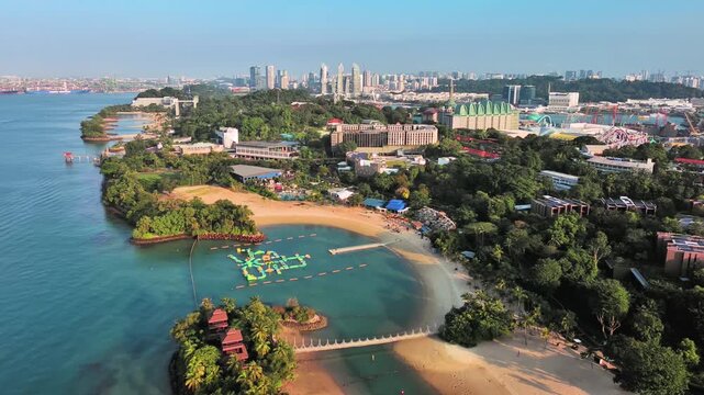 Sentosa Island, Singapore: Aerial view of Palawan Beach on famous island resort, tropical white sand, lush greenery - landscape panorama of Southeast Asia from above
