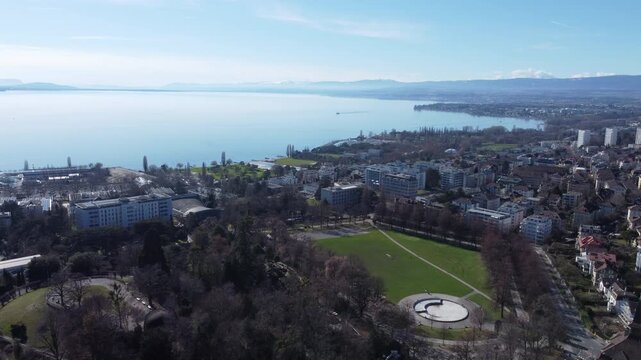 Aerial Forward Motion Over Parc de Milan Toward Lake Geneva, Lausanne