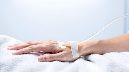 Fototapeta premium Hospital Patient Hand with IV Drip Tube