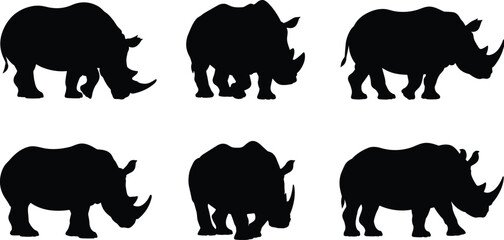 A set of black silhouettes featuring various rhinoceros poses, perfect for wildlife conservation themes, African safari concepts, and zoo education materials, isolated on white. © Mahmud's World