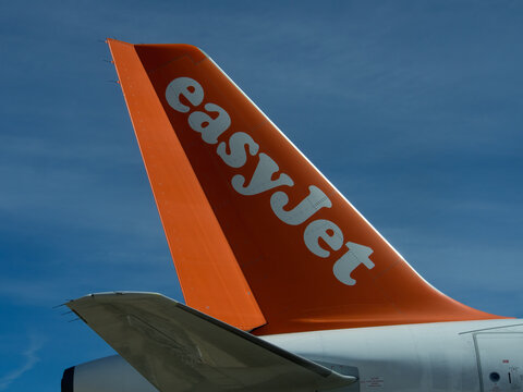 LISBON, PORTUGAL - MARCH 05, 2015:  Tail of Easyjet aircraft showing corporate logo