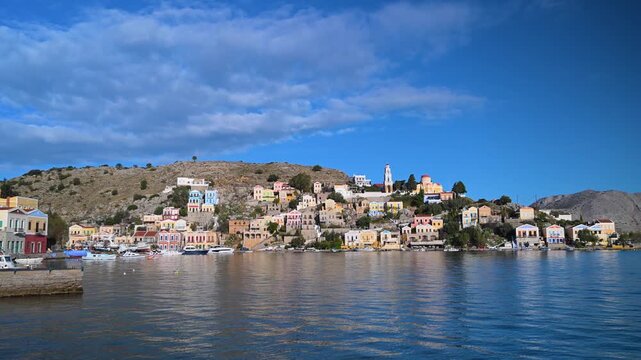 Harbor Town and Blue Sky with Clouds on Symi Island, Greece