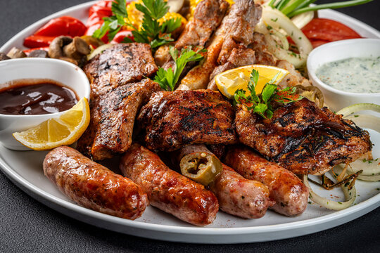 Mixed grilled meat platter with sauces
