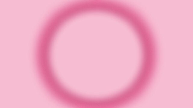 Abstract blurred pink circle frame gently floating on pale pink background