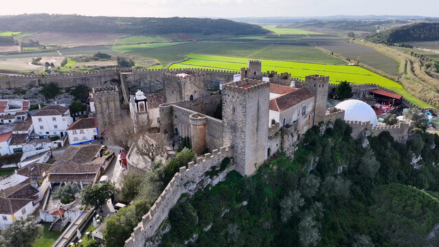 Obidos Castle In Obidos Leiria Portugal. Aerial View Of Landmark Medieval Building In Downtown Scene. Business Clouds Sky Downtown Cityscape. Backgrounds Panoramic. Obidos Leiria.