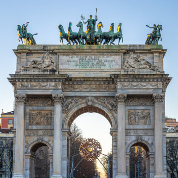 The Milano Cortina winter olympic games flame at Arc of Peace in Milan, Italy 2026.