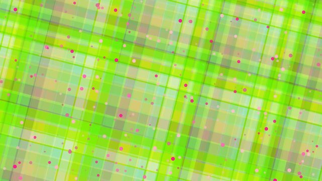 Close-up view of a vibrant green plaid pattern with colorful dots on a fabric texture