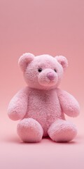 Pink teddy bear on pastel background with soft plush texture