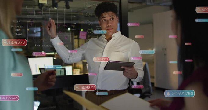 Presenter consulting tablet, pointing at glass grid and generating data overlays for business plan