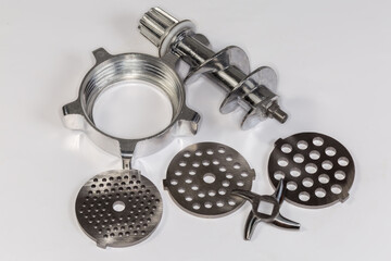 Parts of disassembled attachment of household electric meat grinder