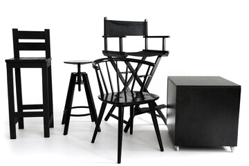 Group of various black chairs and stools isolated on white background