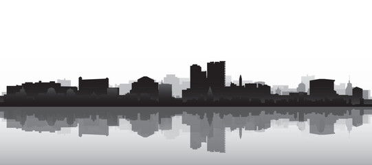 Obraz premium Black and white panoramic poster of the city skyline with misty background buildings and water reflection of MALAGA, SPAIN