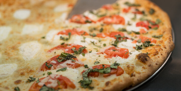 Fresh Margherita Pizza Close Up with Melted Mozzarella,