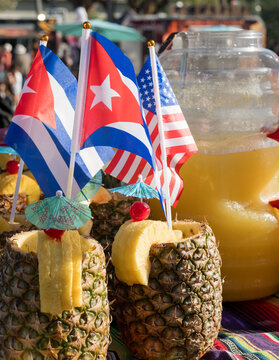 Tropical Pineapple Drinks with Cuban and United States Flags at Outdoor Cultural Festival 