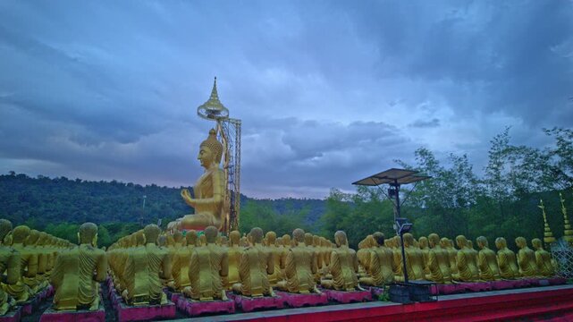  Surrounded by lush hills and open skies, the golden Buddha statues form a tranquil sanctuary for worship, meditation, and candlelight processions, especially during Makha Bucha Day ceremonies.