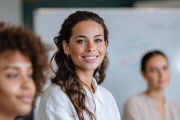 Fototapeta premium Young caucasian female smiling in classroom setting among peers