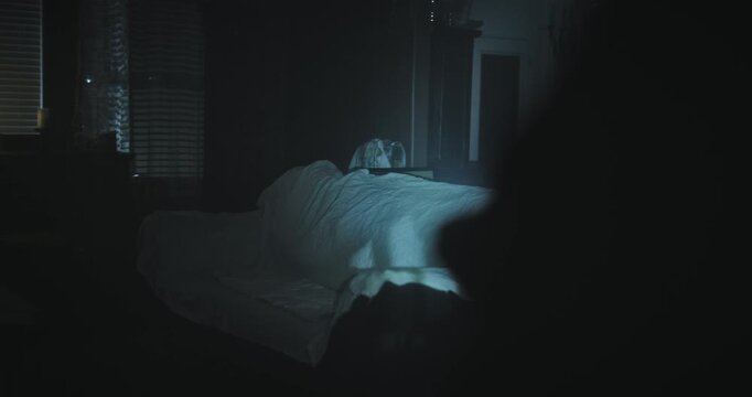 Flashlight shining on spooky, dark living room - steady cam