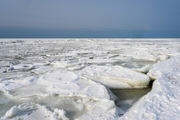 Frozen Baltic Sea Coast with Drift Ice and Snow in Winter © Zigmunds
