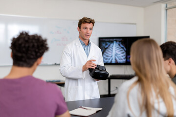 Medical professional showcases VR technology to students in class