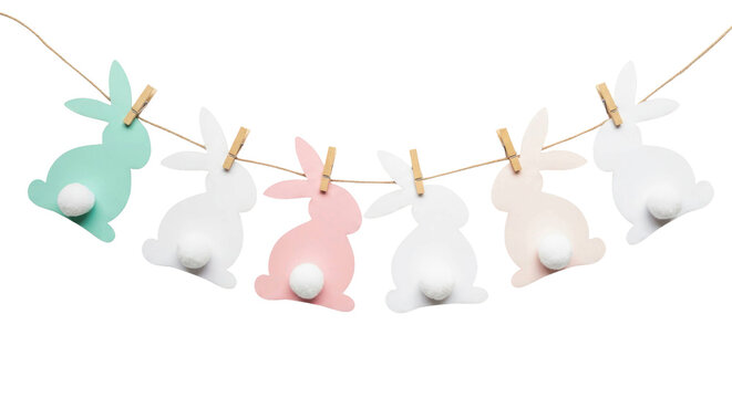 Colorful paper bunnies in pastel shades hanging on a string, ideal for Easter decorations on a transparent background