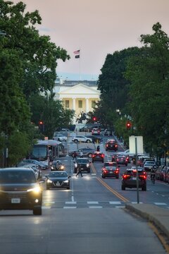 Person crossing the street at sunset in washington dc