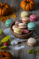 Multicolored macarons on a wooden table