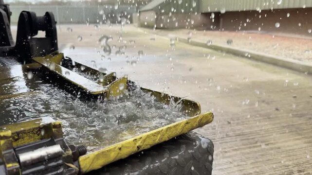 Heavy water splashing on yellow platform detail