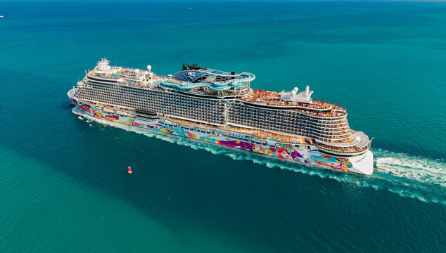 Miami, Florida, USA - April 16, 2025: NCL. Norwegian Aqua cruise ship voyage. Cruise in summer vacation. Norwegian cruise line. Cruise ship tour. Travel at sea. Ship leaving Miami beach port