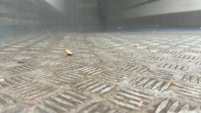 Heavy mist spraying onto steel floor panning