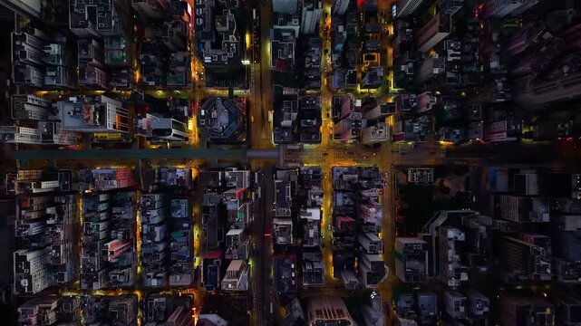 Hong kong kowloon district streets up down drone aerial footage in the evening