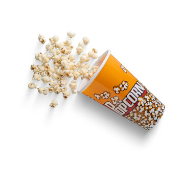isolated Popcorn glass - popcorn in focus, popcorn in a glass, cardboard glass filled with freshly popped popcorn on transparent background,  symbolizing movie night, entertainment, and cinema