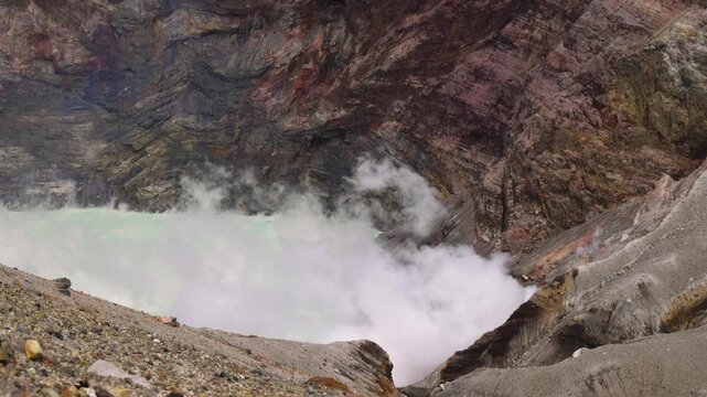 Mount Aso Nakadake volcano crater, Aso-San, caldera, Aso-Kuju National Park hiking, Kyushu island region, Kumamoto prefecture, Japan, eruption with steam and smoke, volcanic desert landscape view
