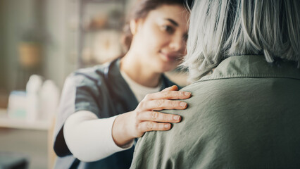 nurse holding patients shoulder