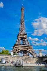 Obraz premium Eiffel Tower and Seine riverbank at summer day, Paris, France