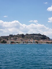 vertical view of a Small island on the blue sea with white clouds