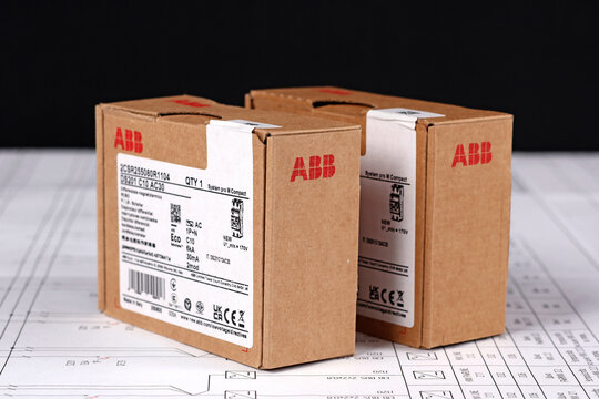 ABB equipment in cardboard packaging on an electronic digram during the assembly of the electrical control panel.