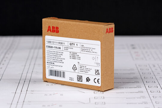 ABB equipment in cardboard packaging on an electronic digram during the assembly of the electrical control panel.