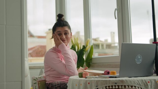 Thoughtful woman planning artistic pattern using tools outdoors